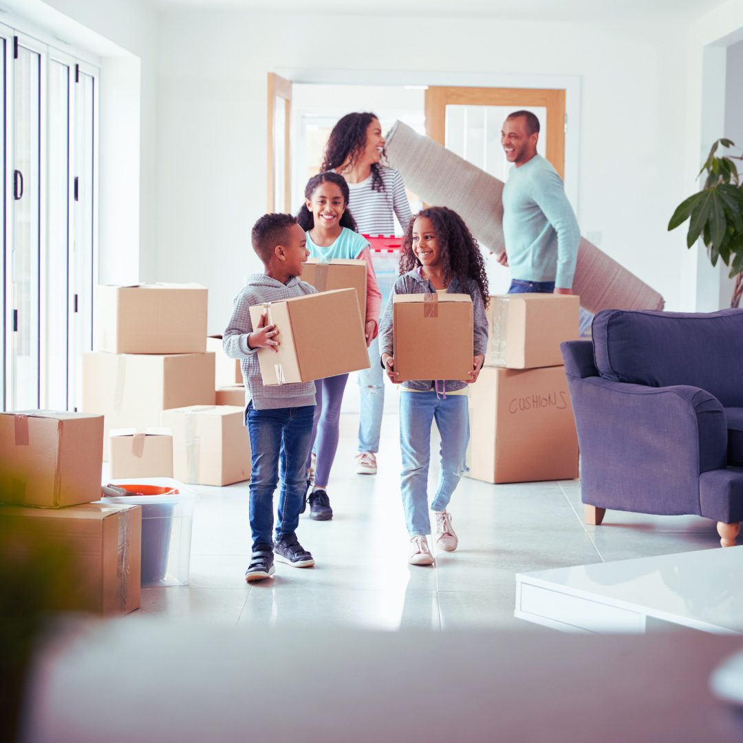 Family bringing in boxes during moving day Alan Fishman Coldwell Banker Realty Franklin County PA