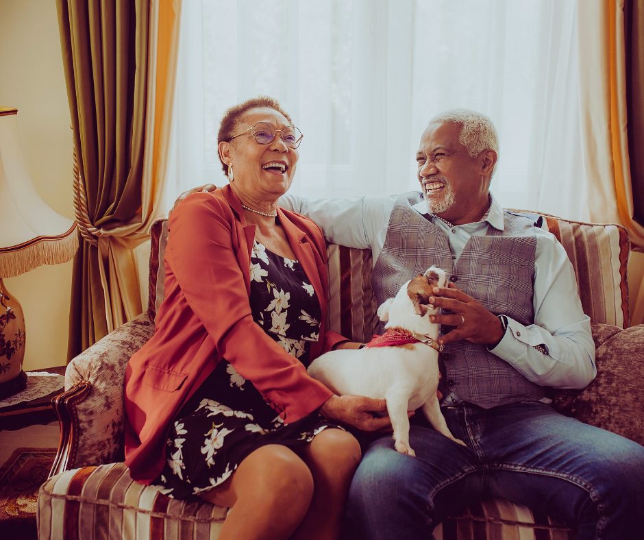 African American Older Couple on Cough With Their Dog Alan Fishman Coldwell Banker Real Estate Fishman Finds Homes